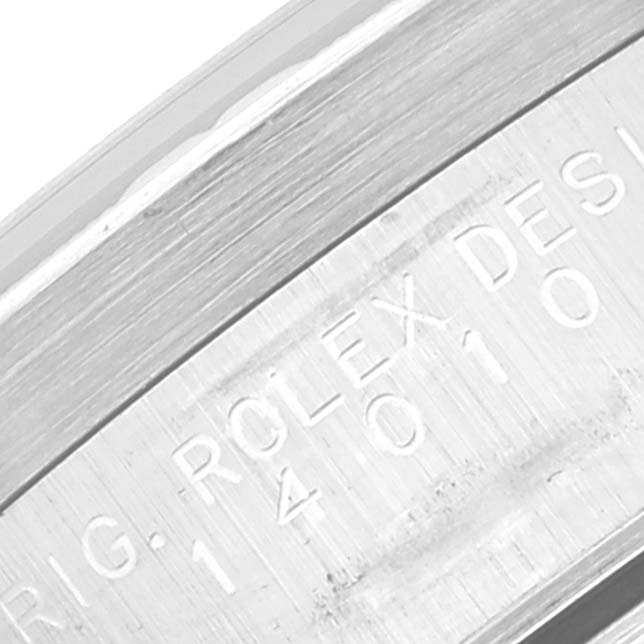 The image shows a close-up view of the engraved bezel on a Rolex Air-King 14010 Men's Stainless Steel Blue Dial 14010 Men's Stainless Steel Blue Dial watch.