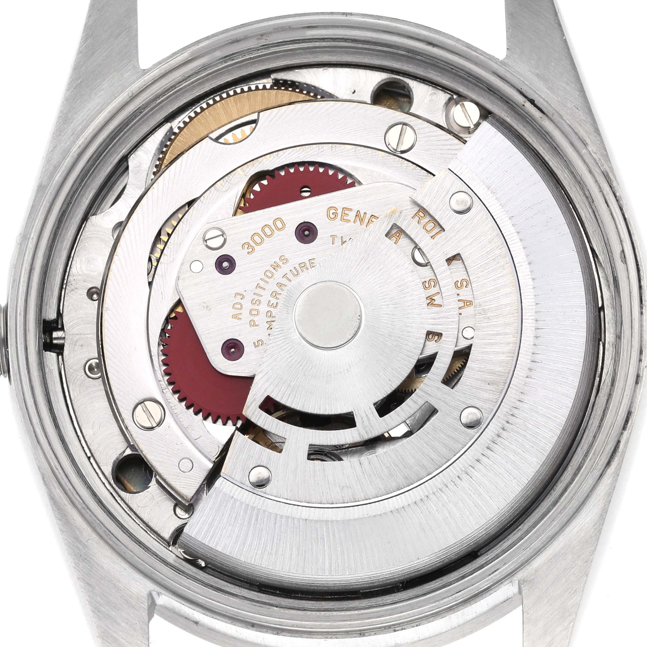 The image shows the internal movement of a Rolex Air-King 14010 Men's Stainless Steel Blue Dial 14010 Men's Stainless Steel Blue Dial watch from a rear angle, highlighting gears and components.