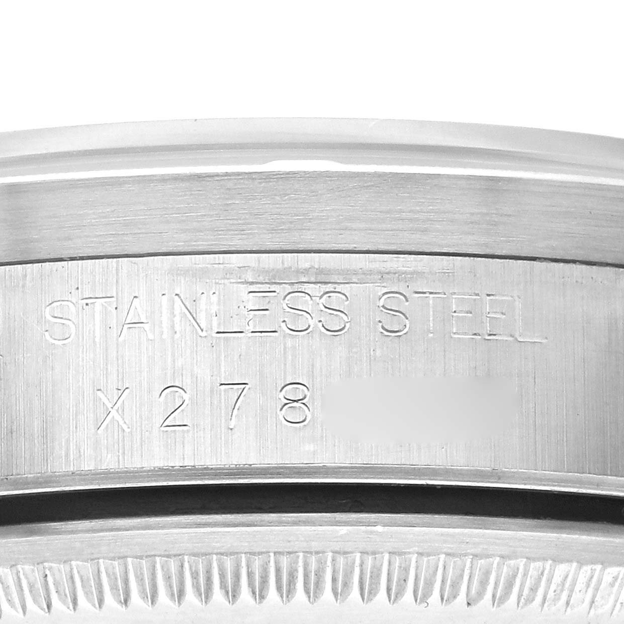 The image shows a close-up side view of the Rolex Air-King 14010 Men's Stainless Steel Blue Dial 14010 Men's Stainless Steel Blue Dial watch's stainless steel case with engravings.