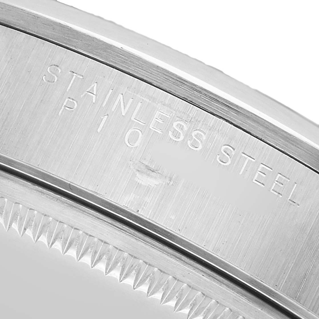 The image shows a close-up of the stainless steel case back edge of a Rolex Air-King 14000 Men's Stainless Steel Pink Dial watch, highlighting the engraving.