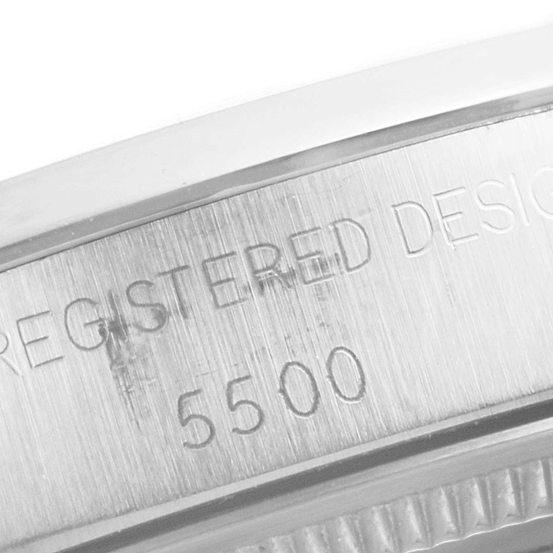 The image shows an engraved side view of the Rolex Vintage Collection 5500 Men's Stainless Steel Blue Dial 5500 Men's Stainless Steel Blue Dial model, featuring the text "REGISTERED DESIGN" and "5500".