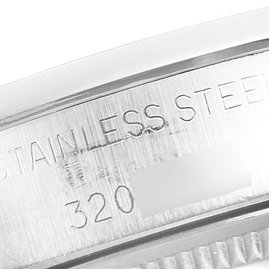 This close-up image shows the side of the case of a Rolex Vintage Collection 5500 Men's Stainless Steel Blue Dial 5500 Men's Stainless Steel Blue Dial model, highlighting the "STAINLESS STEEL" engraving.