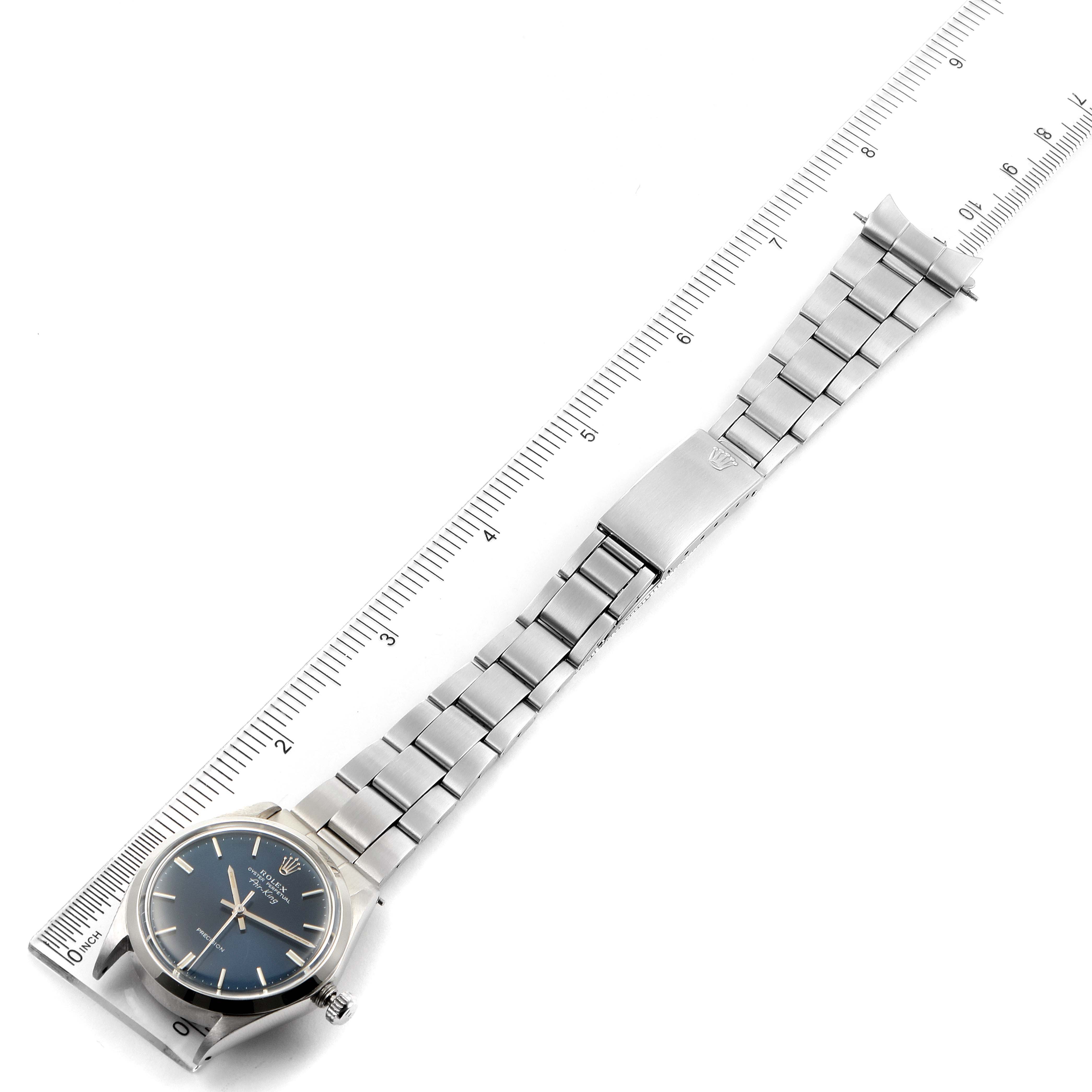 The image shows a bird's-eye view of a Rolex Vintage Collection 5500 Men's Stainless Steel Blue Dial 5500 Men's Stainless Steel Blue Dial watch, focusing on its face and metal band measured with a ruler.