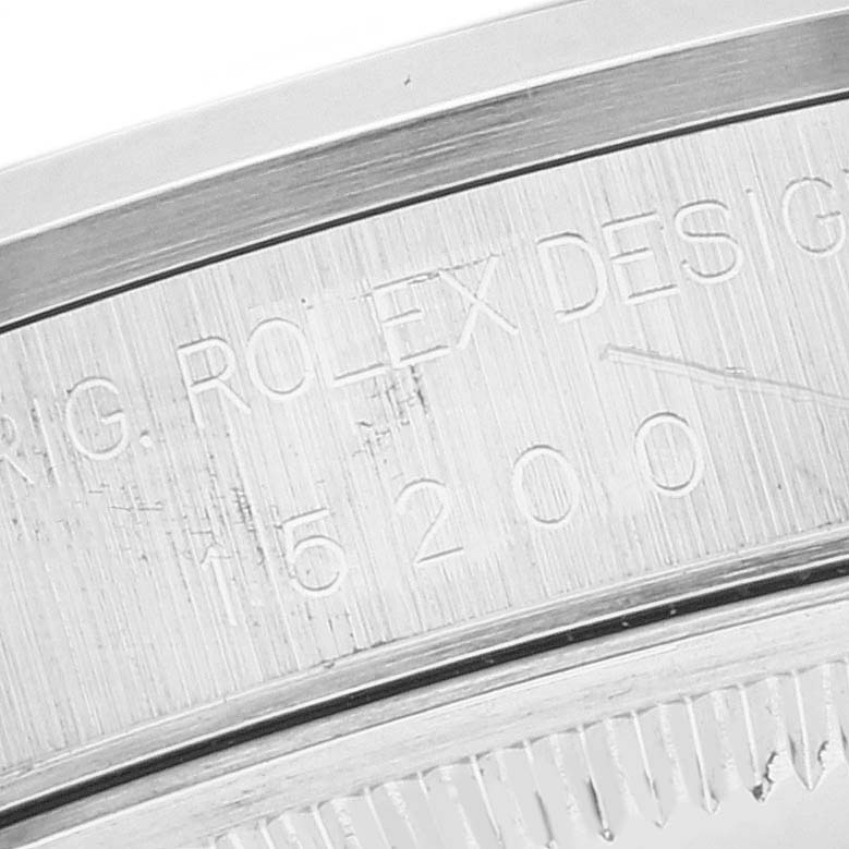 This image shows a close-up of the engravings on the case back of a Rolex Date 15200 Men's Stainless Steel Black Dial 15200 Men's Stainless Steel Black Dial model watch.
