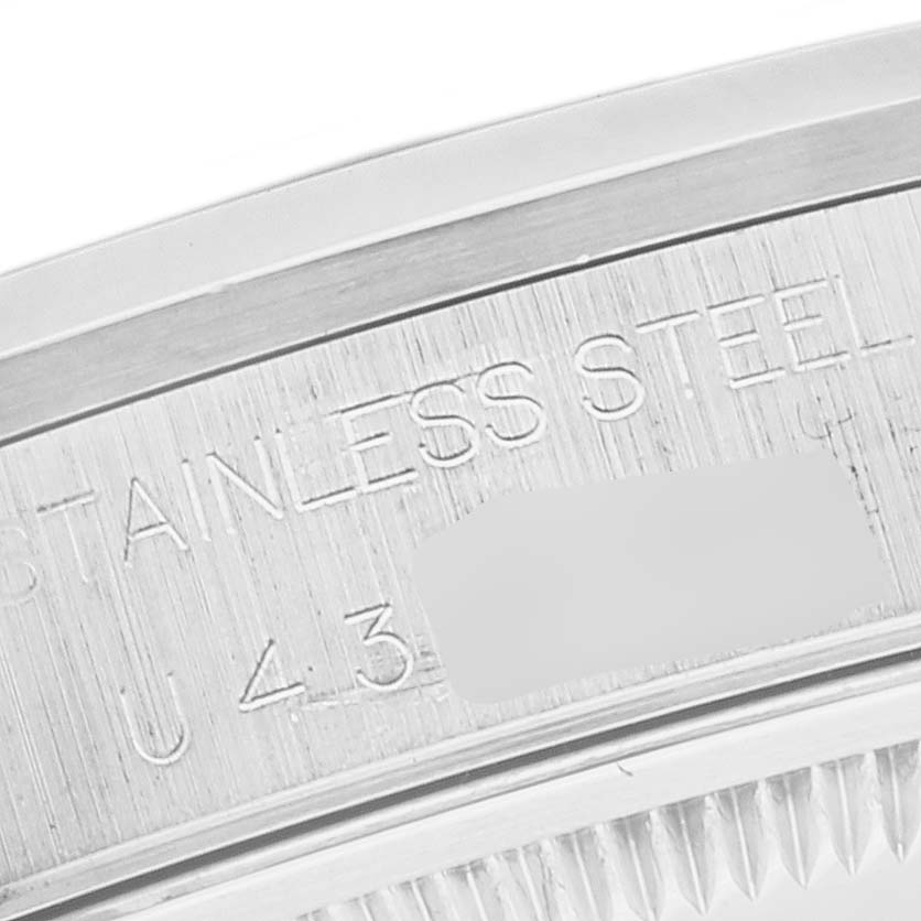 This image shows a close-up of the engraved inner bezel of a Rolex Date 15200 Men's Stainless Steel Black Dial 15200 Men's Stainless Steel Black Dial model watch, highlighting the text "STAINLESS STEEL."