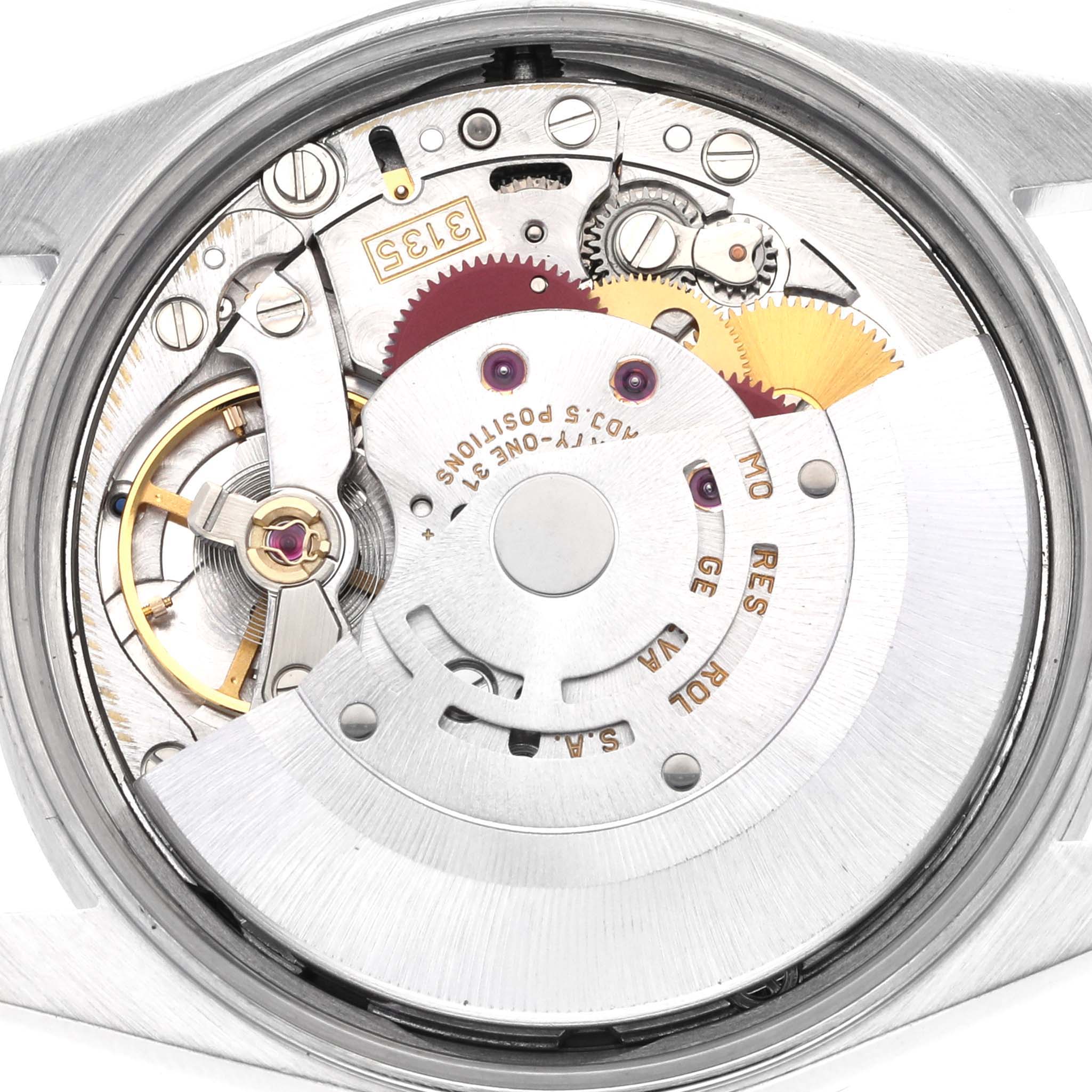 The image shows the internal mechanism of a Rolex Date 15210 Men's Stainless Steel Blue Dial 15210 Men's Stainless Steel Blue Dial watch from a back angle, highlighting gears and movement components.