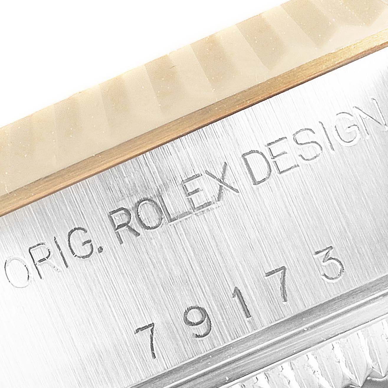 This image shows a close-up of the model number and engravings on the side of a Rolex Datejust 79173 Women's Steel and Gold (two tone) Silver Dial 79173 Women's Steel and Gold (two tone) Silver Dial watch case.
