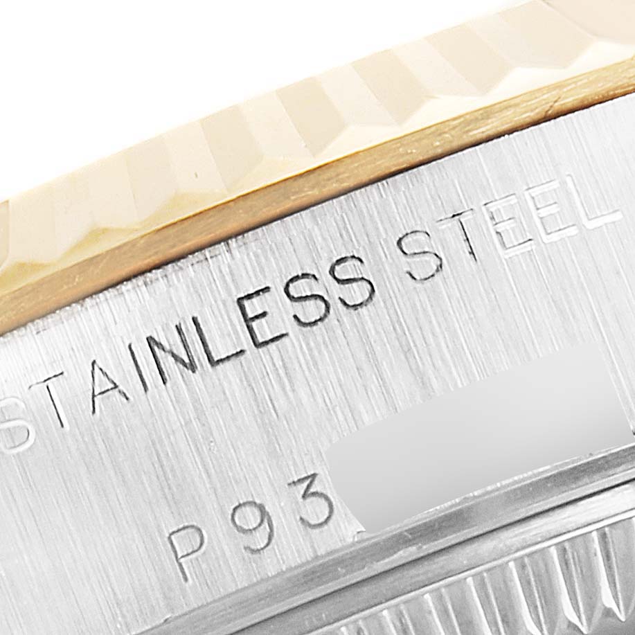 The image shows a close-up of the side of a Rolex Datejust 79173 Women's Steel and Gold (two tone) Silver Dial 79173 Women's Steel and Gold (two tone) Silver Dial watch, focusing on the stainless steel engraving and partially visible bezel.