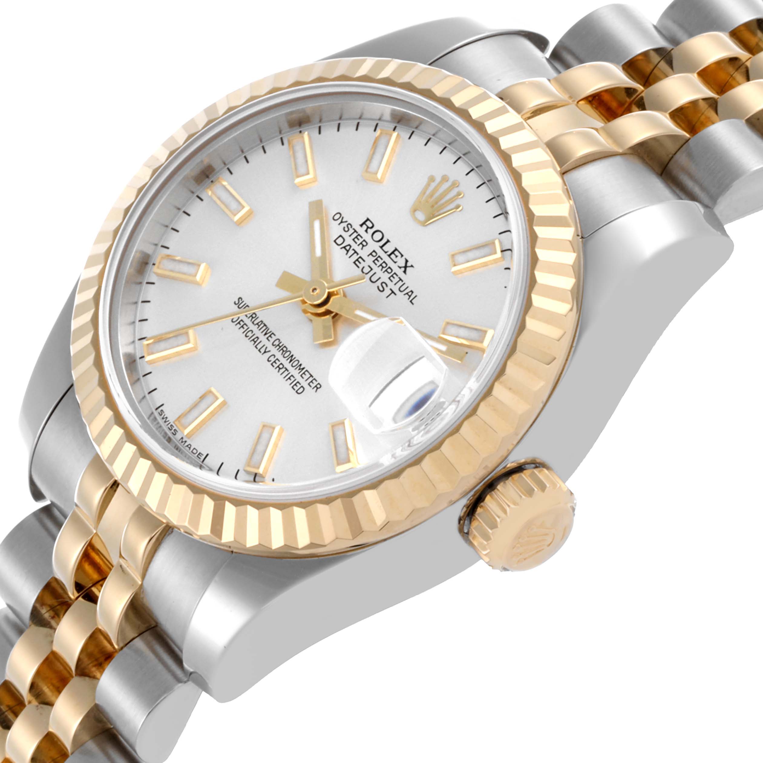 The Rolex Datejust 179173 Women's Steel and Gold (two tone) Silver Dial 179173 Women's Steel and Gold (two tone) Silver Dial watch is shown at an angled side view, revealing the face, bezel, crown, and Jubilee bracelet.