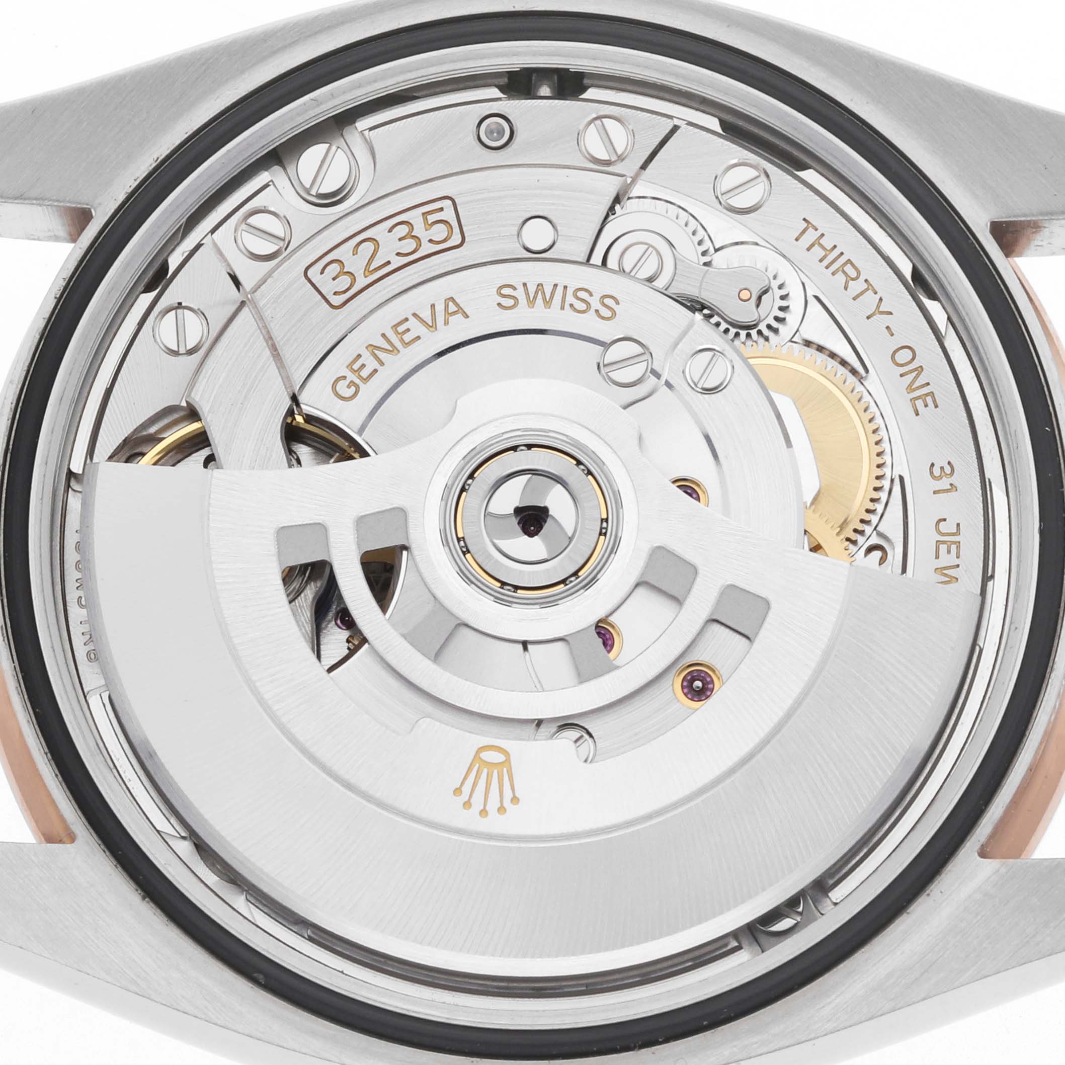 The image shows the movement of a Rolex Datejust 126281 Men's Steel and Gold (two tone) Pink Dial, focusing on the rear with visible rotor and intricate mechanics.