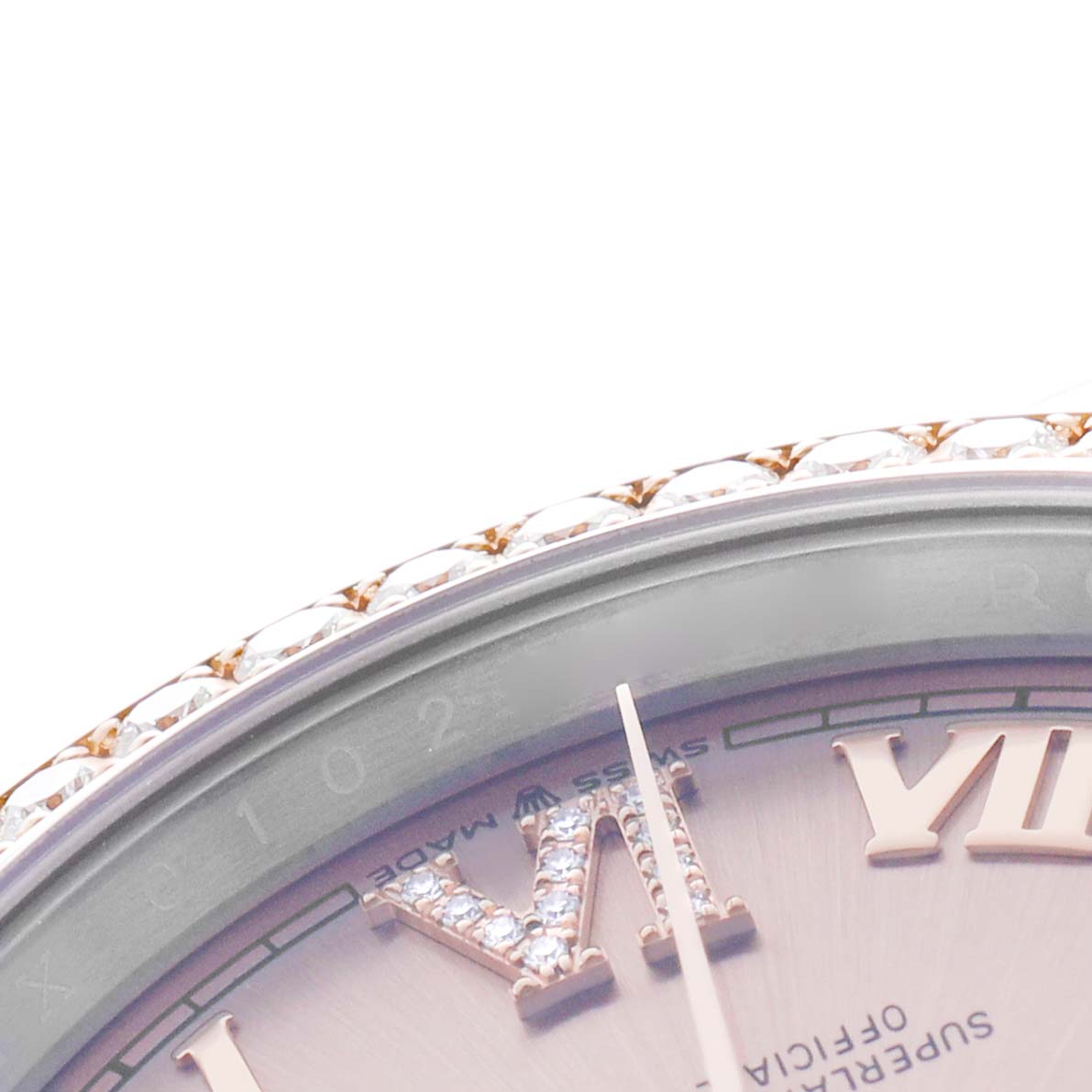 The image shows a close-up of the top part of the Rolex Datejust 126281 Men's Steel and Gold (two tone) Pink Dial watch, focusing on the diamond bezel and Roman numeral markers.