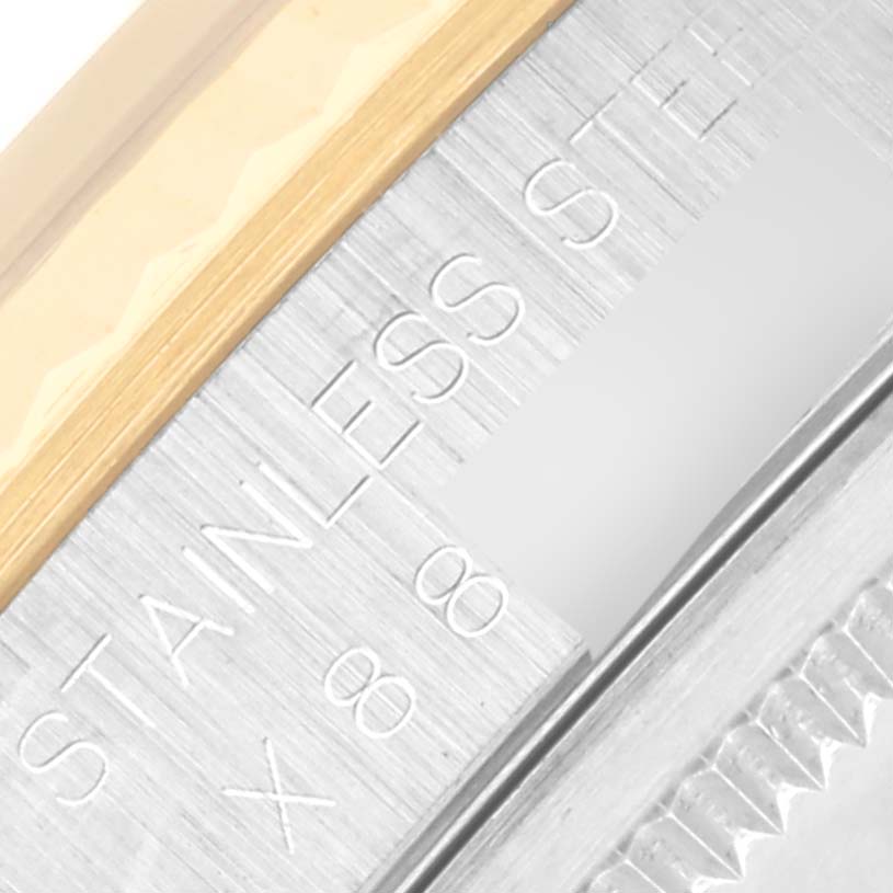 The image shows a close-up of the bezel and engraved markings on a Rolex Datejust 16233 Men's Steel and Gold (two tone) Silver Dial 16233 Men's Steel and Gold (two tone) Silver Dial watch.