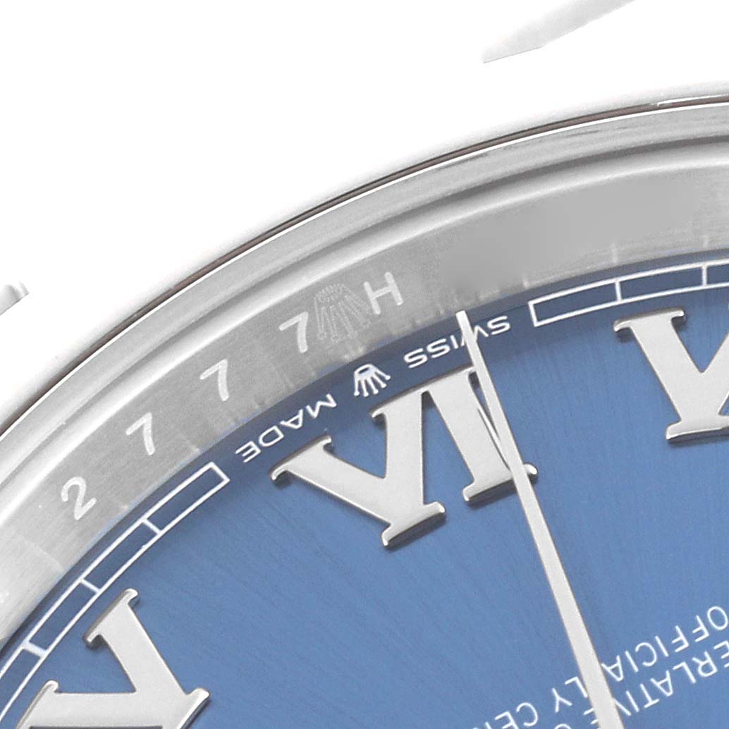 The image shows a close-up of the dial and bezel edge of a Rolex Datejust 41 126300 Men's Stainless Steel Blue Dial 126300 Men's Stainless Steel Blue Dial, highlighting Roman numerals and "Swiss Made" text.