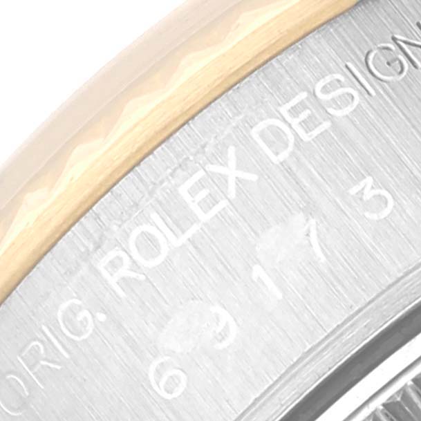 This close-up image shows the engraved bezel of a Rolex Datejust 69173 Women's Steel and Gold (two tone) Blue Dial 69173 Women's Steel and Gold (two tone) Blue Dial watch.