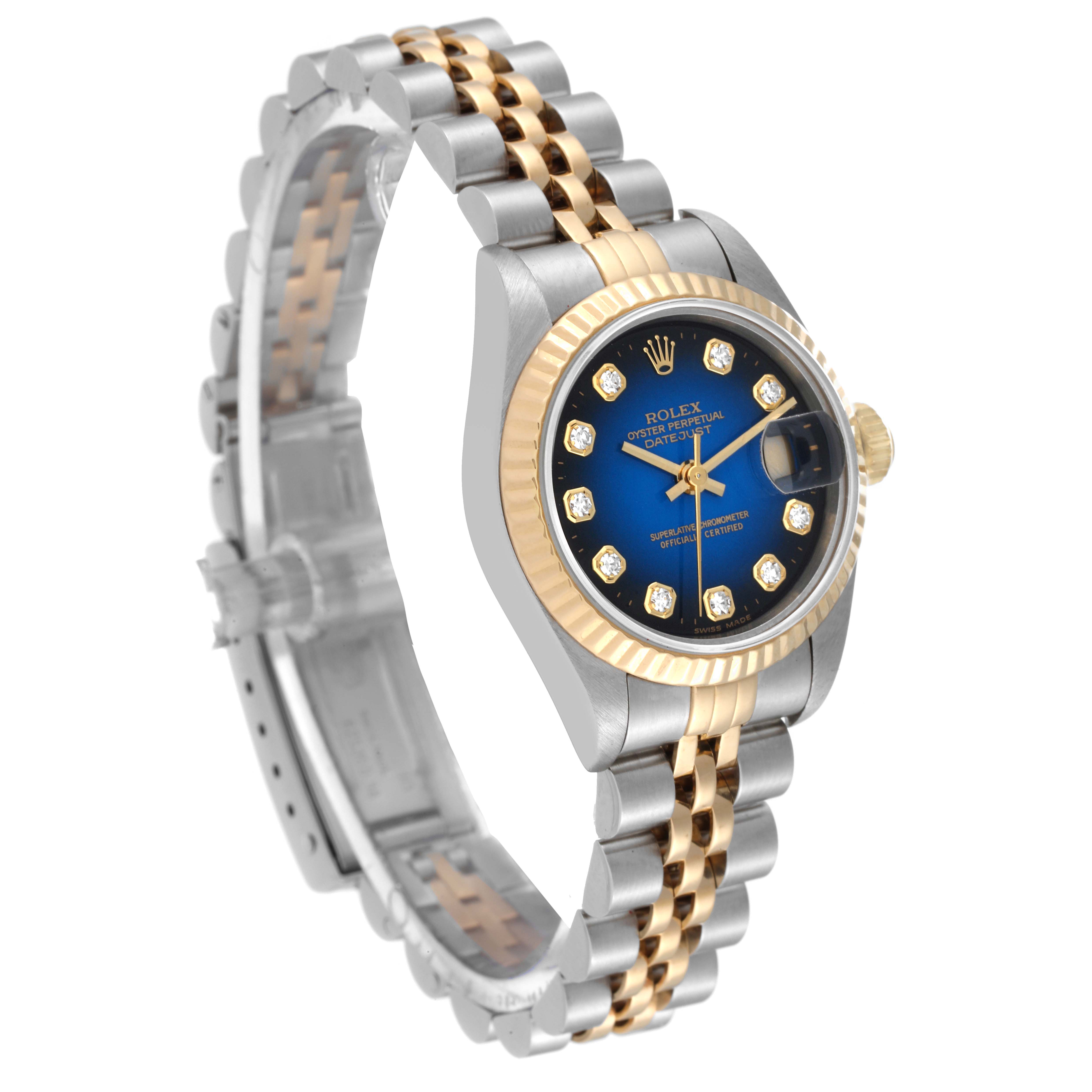 This image shows a Rolex Datejust 69173 Women's Steel and Gold (two tone) Blue Dial 69173 Women's Steel and Gold (two tone) Blue Dial watch at a three-quarter angle, highlighting its two-tone bracelet and blue dial with diamond indices.