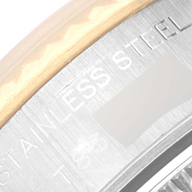The image shows a close-up view of the outer edge and part of the casing of a Rolex Datejust 69173 Women's Steel and Gold (two tone) Blue Dial 69173 Women's Steel and Gold (two tone) Blue Dial watch, highlighting the stainless steel and text.