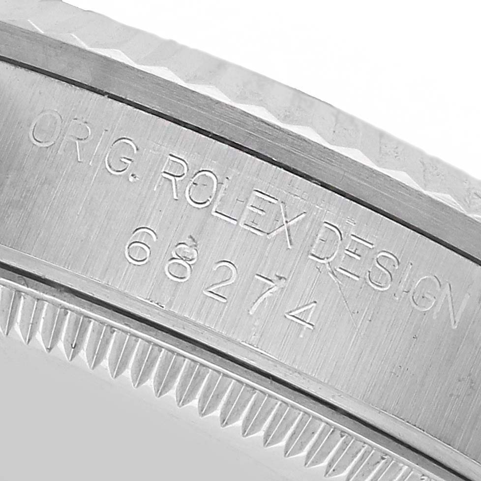 The image shows the edged side and engraved model number "68274" of a Rolex Mid-Size 68274 Women's Stainless Steel Silver Dial watch, focusing on the bezel details.