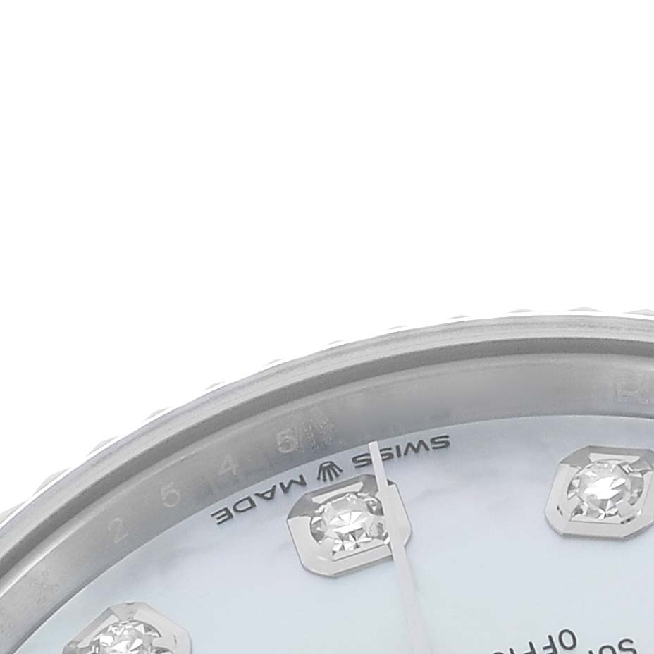 The image shows a close-up of the dial and diamond markers of the mid-size Rolex watch, focusing on the upper edge.