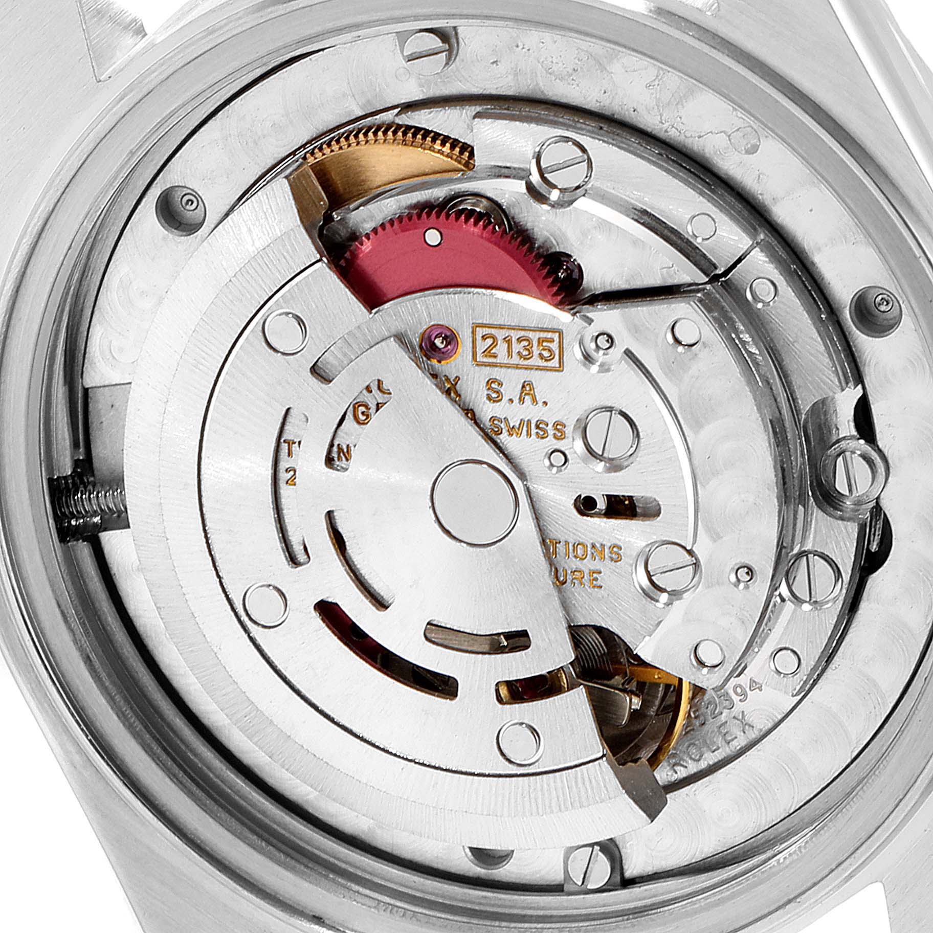 The image shows a close-up view of the movement mechanism in a mid-size Rolex watch model 2135.