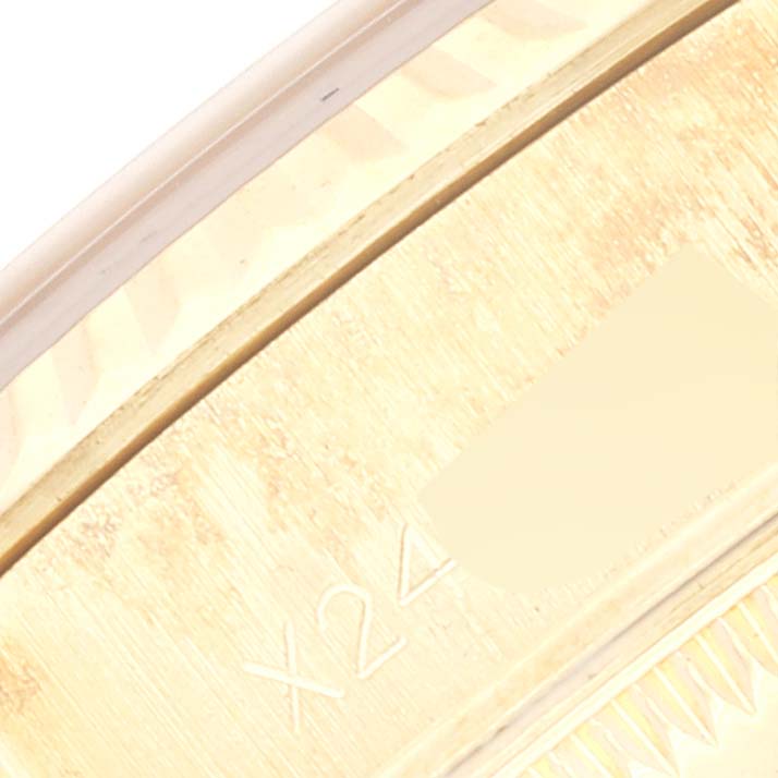 This image shows a close-up of the case edge and part of the bezel of a Rolex President 69178 Women
s Yellow Gold Champagne Dial 69178 Women
s Yellow Gold Champagne Dial model watch.