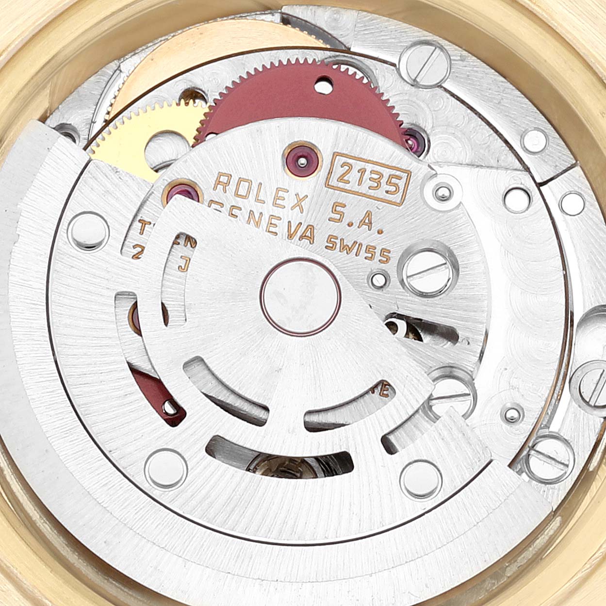 This image shows the intricate internal mechanism of a Rolex President 69178 Women
s Yellow Gold Champagne Dial 69178 Women
s Yellow Gold Champagne Dial model watch, highlighting the gears and engravings.