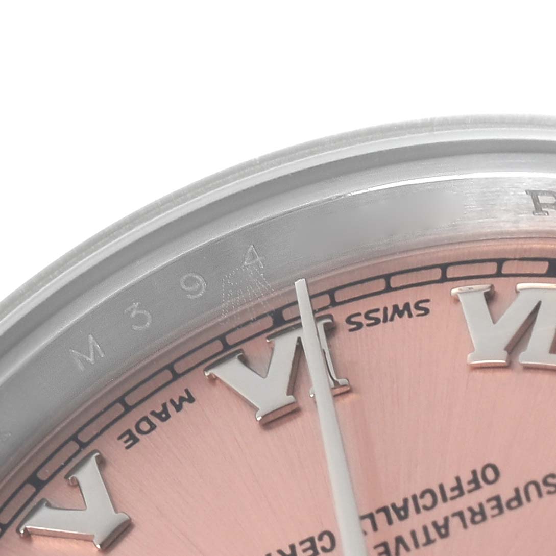 This close-up image shows part of the dial, with Roman numerals and text details of the Rolex Datejust 179160 Women's Stainless Steel Pink Dial 179160 Women's Stainless Steel Pink Dial model.