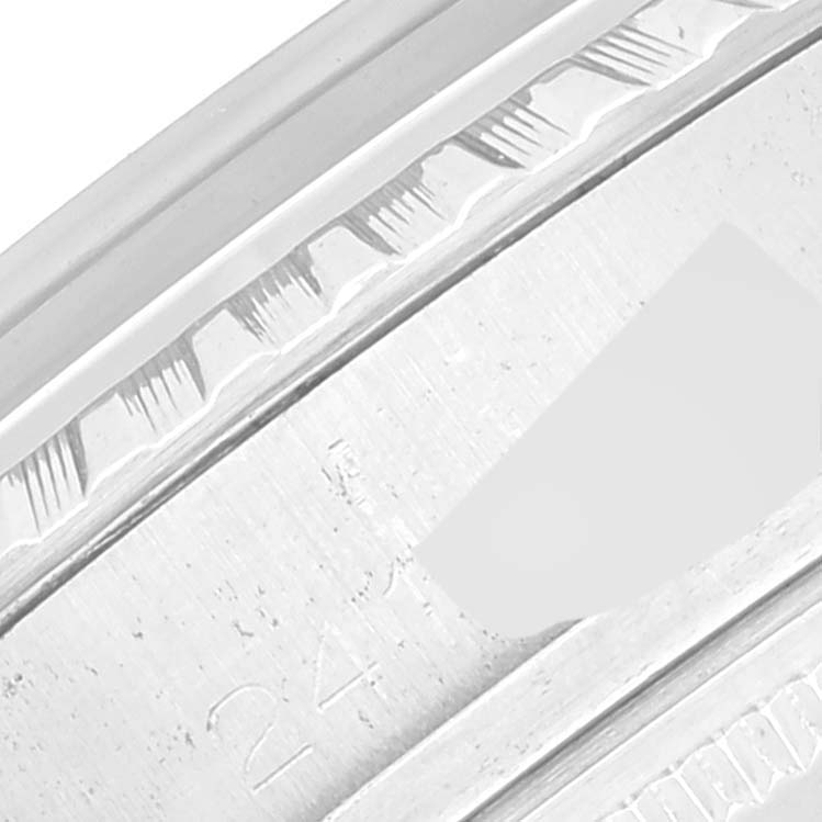 This close-up angle shows part of the bezel and casing of the Rolex Vintage Collection 1603 Men's Stainless Steel Silver Dial 1603 Men's Stainless Steel Silver Dial model.