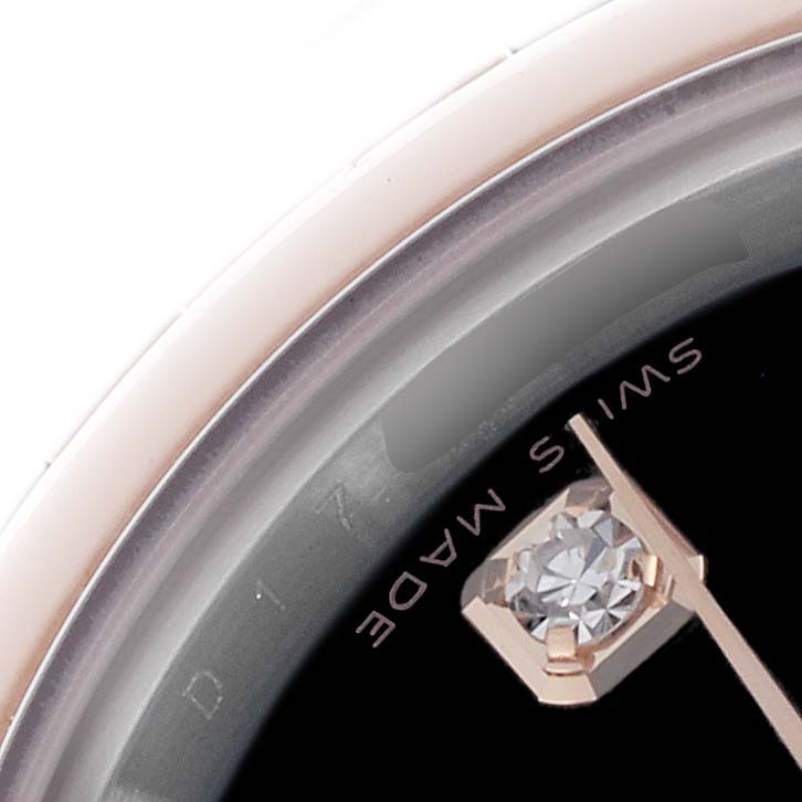 The image shows a close-up of the dial and bezel edge of a Rolex Datejust 179161 Women's Steel and Gold (two tone) Black Dial 179161 Women's Steel and Gold (two tone) Black Dial, highlighting a diamond marker.