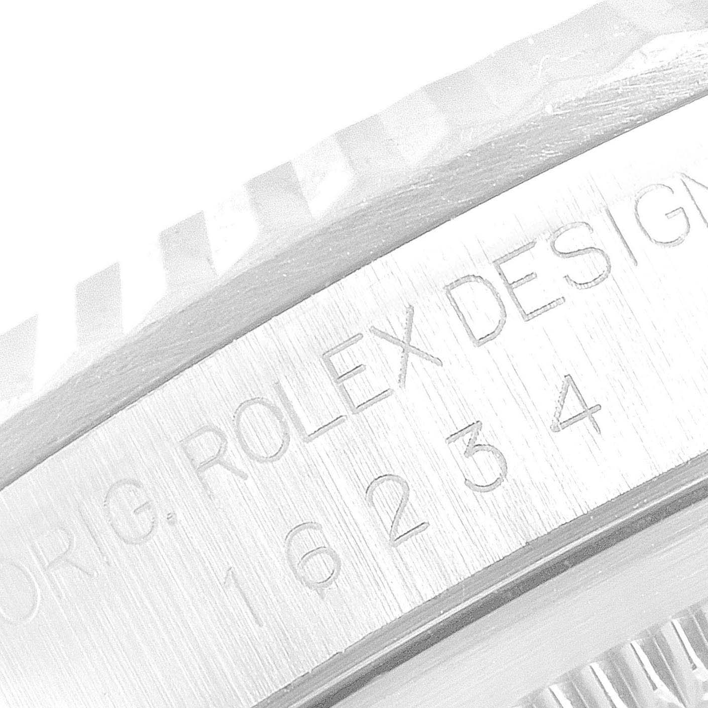 This image shows a close-up of the case side and bezel of a Rolex Datejust 16234 Men's Stainless Steel Silver Dial 16234 Men's Stainless Steel Silver Dial, highlighting the model number engraving.