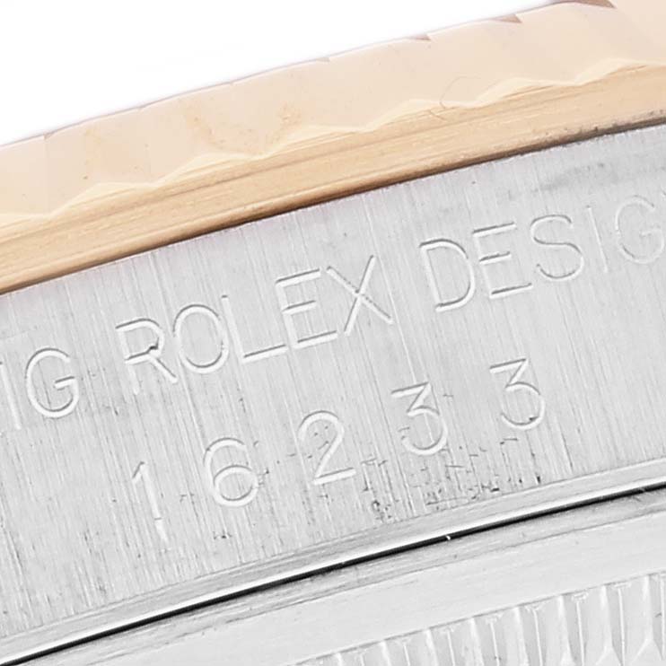 This close-up image shows the engraved bezel and case of a Rolex Datejust 16233 Men's Steel and Gold (two tone) Black Dial 16233 Men's Steel and Gold (two tone) Black Dial watch, emphasizing its model number.