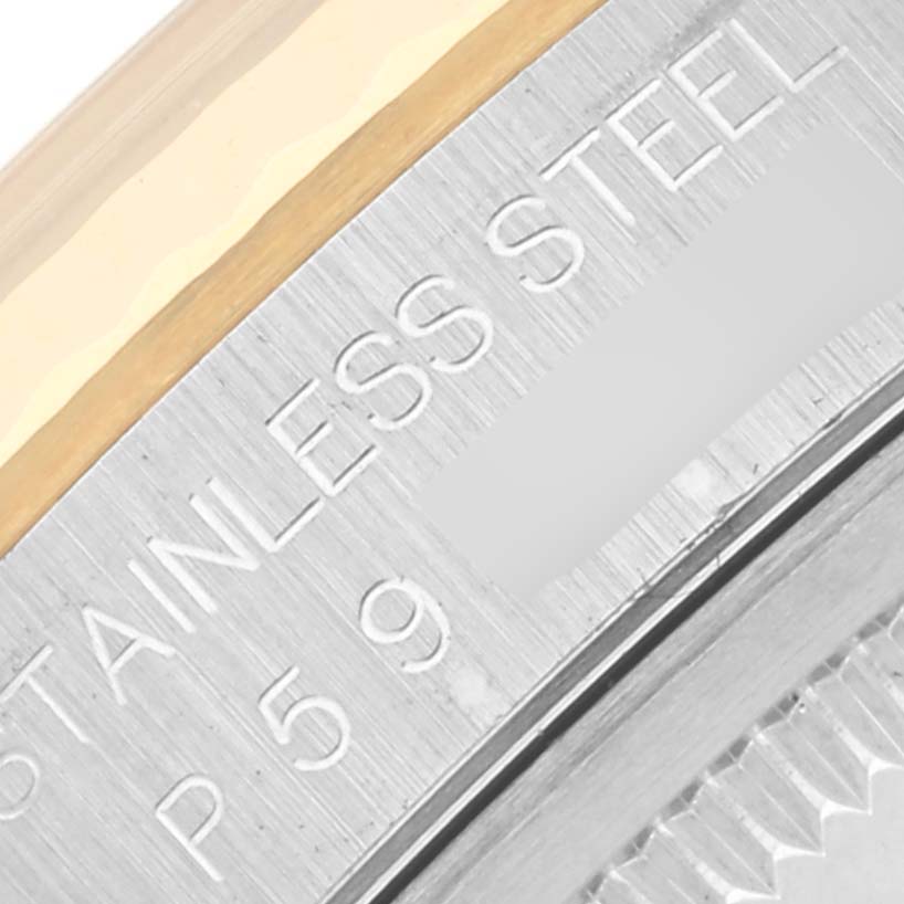 The image shows a close-up of the stainless steel case back edge of a Rolex Datejust 16233 Men's Steel and Gold (two tone) Black Dial 16233 Men's Steel and Gold (two tone) Black Dial watch.