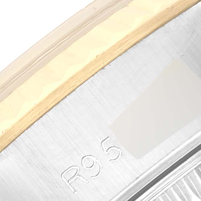 The image shows a close-up of the bezel and part of the casing of a Rolex Datejust 69173 Women's Steel and Gold (two tone) Champagne Dial 69173 Women's Steel and Gold (two tone) Champagne Dial watch.