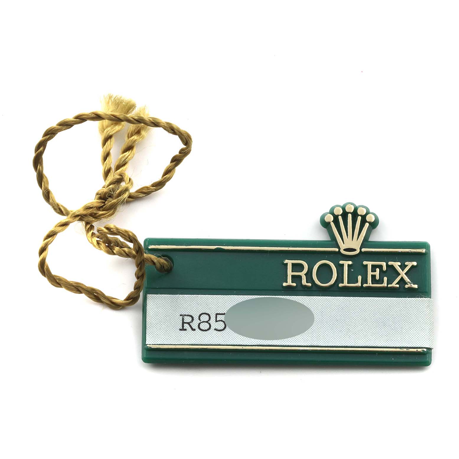 This image shows a green Rolex Datejust 69173 Women's Steel and Gold (two tone) Champagne Dial 69173 Women's Steel and Gold (two tone) Champagne Dial model tag with a gold string attached.