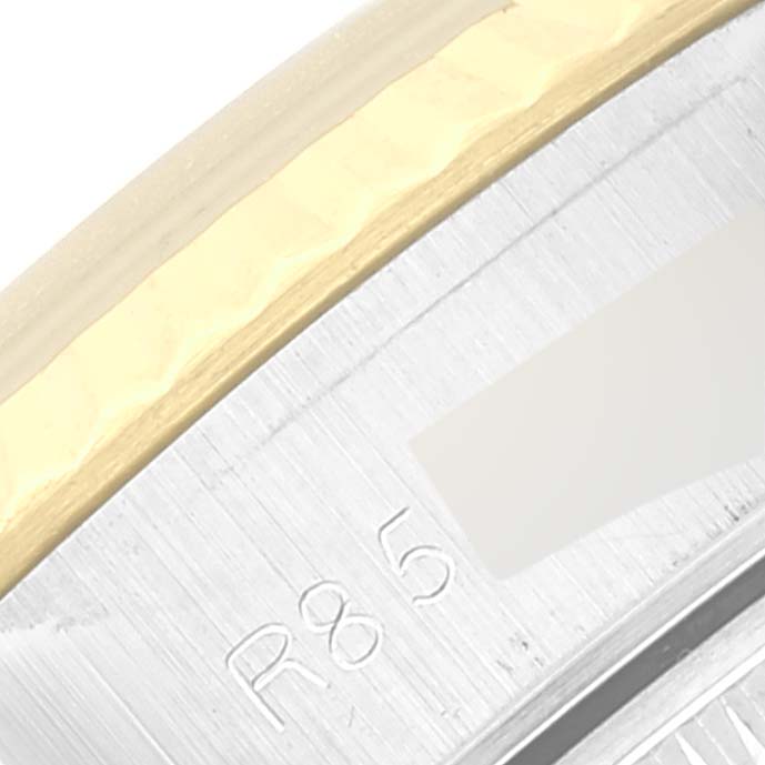 The image shows a close-up of the bezel and edge of the case of a Rolex Datejust 69173 Women's Steel and Gold (two tone) Champagne Dial 69173 Women's Steel and Gold (two tone) Champagne Dial watch, highlighting the metallic finish and engravings.