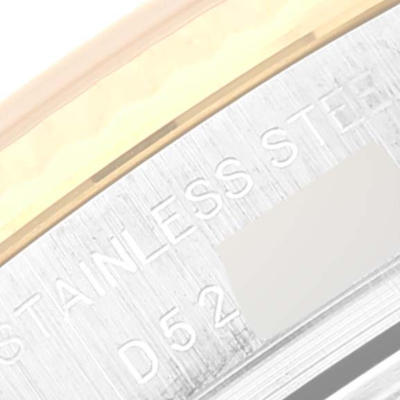 This close-up image shows the engravings on the side of a Rolex Datejust 179173 Women's Steel and Gold (two tone) Beige Dial 179173 Women's Steel and Gold (two tone) Beige Dial stainless steel casing.