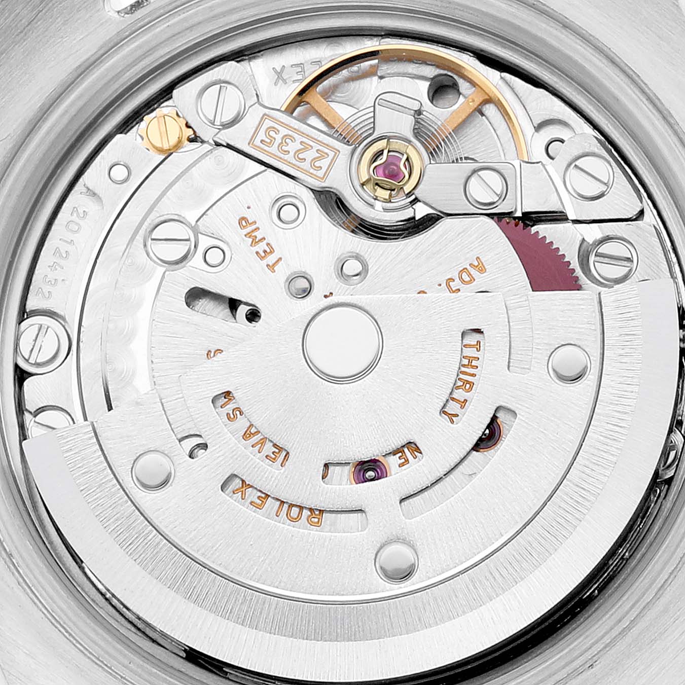 This image shows the internal mechanism, including the rotor, gears, and bridges, of a Rolex Datejust 179173 Women's Steel and Gold (two tone) Beige Dial 179173 Women's Steel and Gold (two tone) Beige Dial watch viewed from the back.