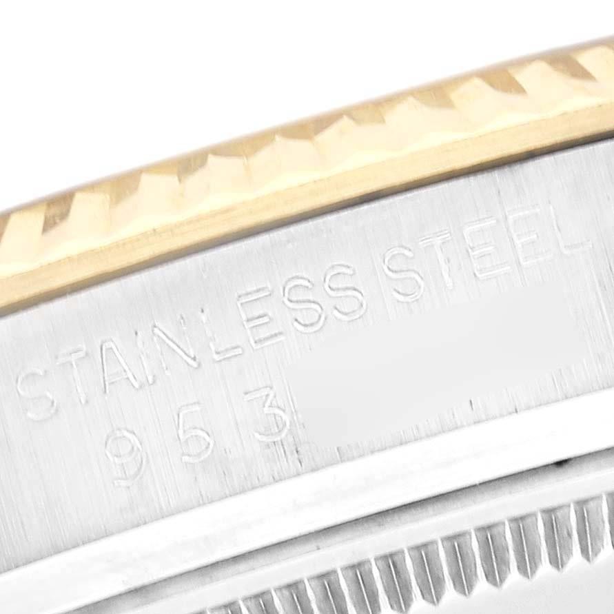 This image shows a close-up of the stainless steel engraved part and gold bezel of a Rolex Vintage Collection 16013 Men's Steel and Gold (two tone) Champagne Dial 16013 Men's Steel and Gold (two tone) Champagne Dial model watch.