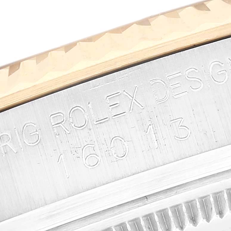 Close-up of the side of a Rolex Vintage Collection 16013 Men's Steel and Gold (two tone) Champagne Dial 16013 Men's Steel and Gold (two tone) Champagne Dial watch showing the model number “16013” engraved on the casing.