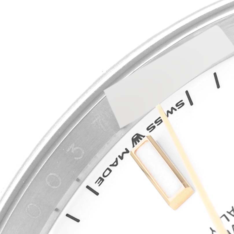 The image shows a close-up of the dial and part of the bezel of a Rolex Datejust 126233 Men's Steel and Gold (two tone) White Dial 126233 Men's Steel and Gold (two tone) White Dial watch, focusing on the "Swiss Made" text.