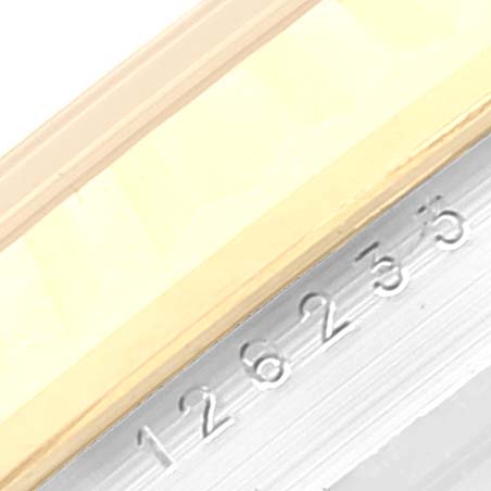 The image shows a close-up of the bezel and the engraved rehaut of a Rolex Datejust 126233 Men's Steel and Gold (two tone) White Dial 126233 Men's Steel and Gold (two tone) White Dial watch.
