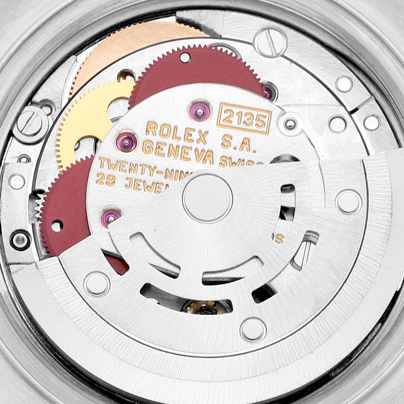 This image shows the intricate internal movement and components of a Rolex Datejust 69173 Women's Steel and Gold (two tone) White Dial 69173 Women's Steel and Gold (two tone) White Dial watch, highlighting gears and engravings.