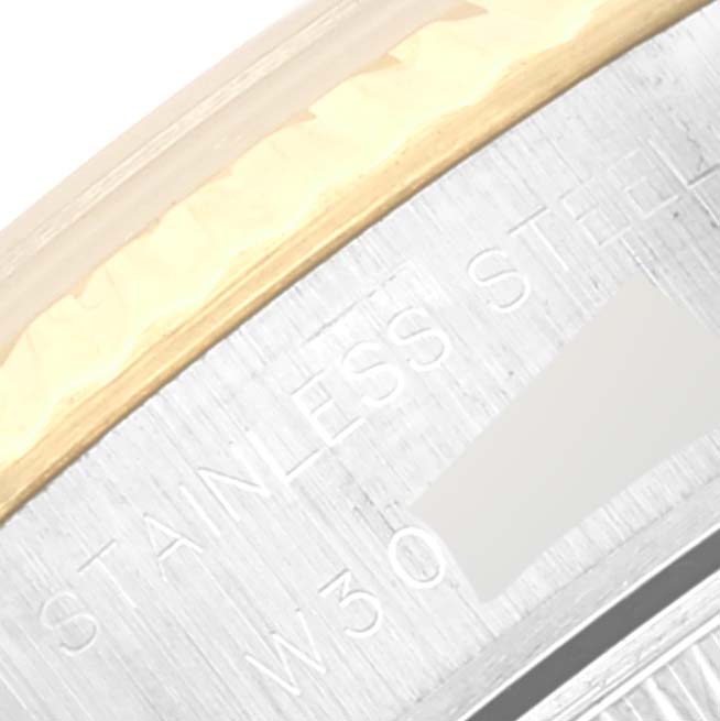 The image shows a close-up of the stainless steel casing with engraved text of the Rolex Datejust 69173 Women's Steel and Gold (two tone) White Dial 69173 Women's Steel and Gold (two tone) White Dial watch.