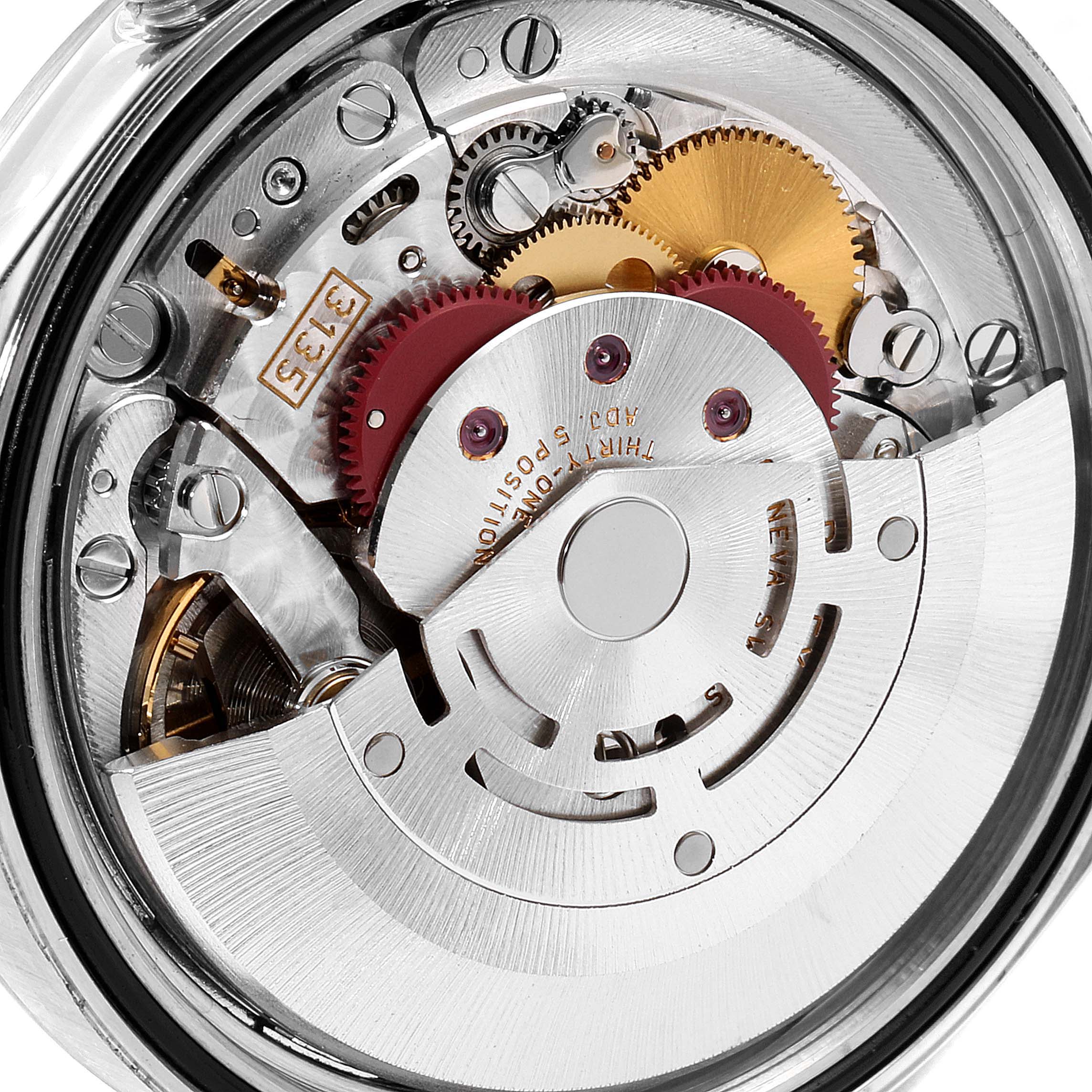 This image shows a close-up view of the movement mechanism inside a Rolex Datejust 16200 Men's Stainless Steel White Dial 16200 Men's Stainless Steel White Dial watch, highlighting gears and components.