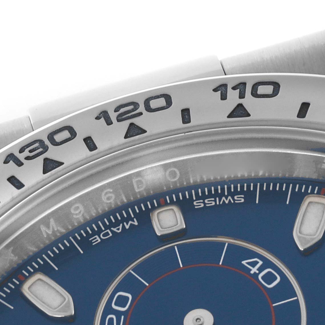 The image shows a close-up of the bezel and dial of a Rolex Daytona 116509 Men's White Gold Blue Dial 116509 Men's White Gold Blue Dial watch, highlighting the tachymetric scale.