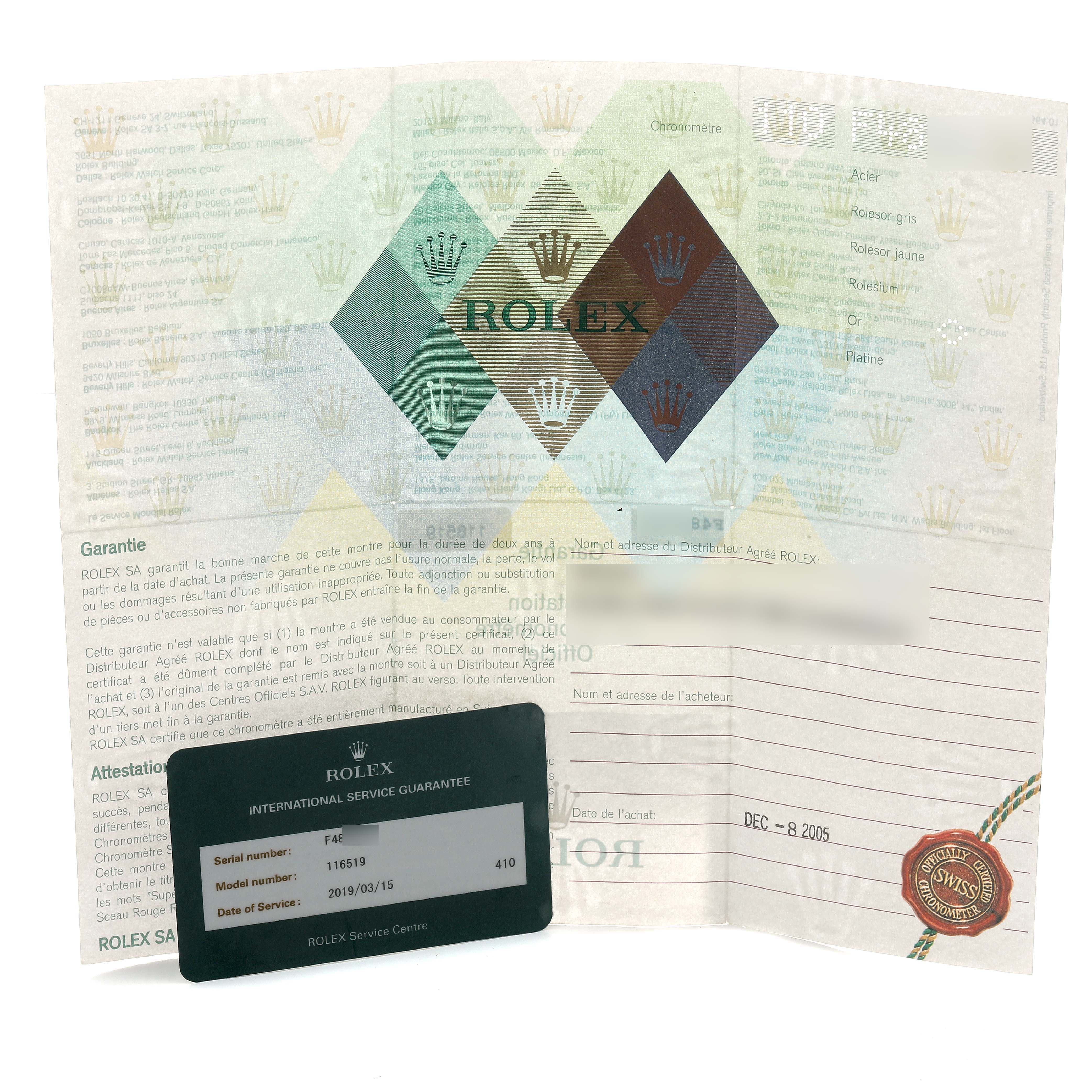 The image shows a Rolex Daytona 116519 Men's White Gold Silver Dial warranty card and pamphlet with service details.