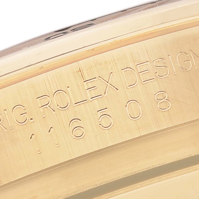 The image shows a close-up of the Rolex Daytona 116508 Men's Yellow Gold Green Dial 116508 Men's Yellow Gold Green Dial's case, highlighting its engraved design and model number.