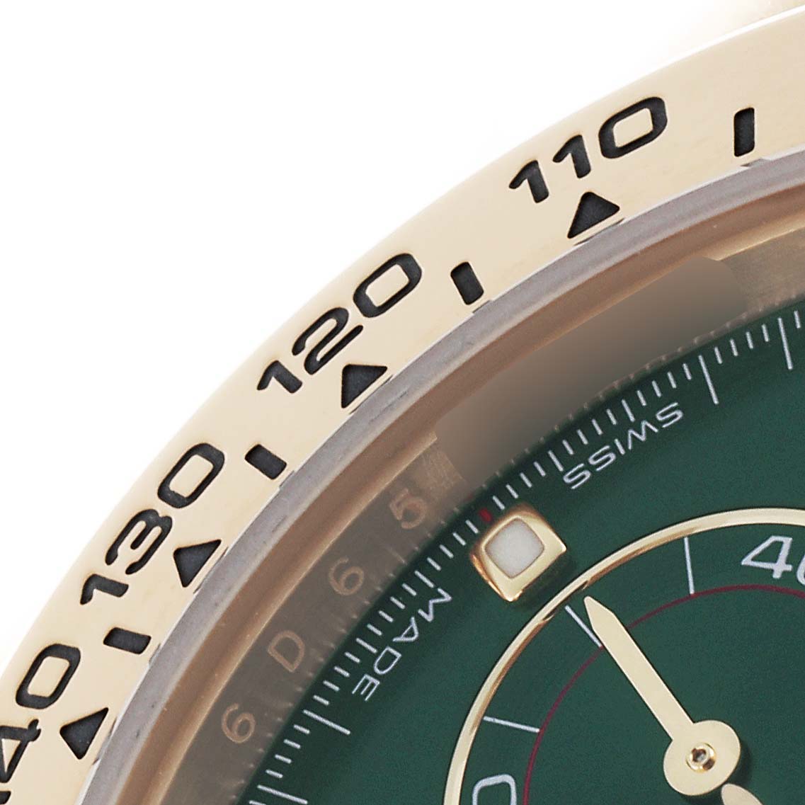 The image shows a close-up of the bezel and dial of a Rolex Daytona 116508 Men's Yellow Gold Green Dial 116508 Men's Yellow Gold Green Dial watch, highlighting the tachymetric scale and part of the green dial.