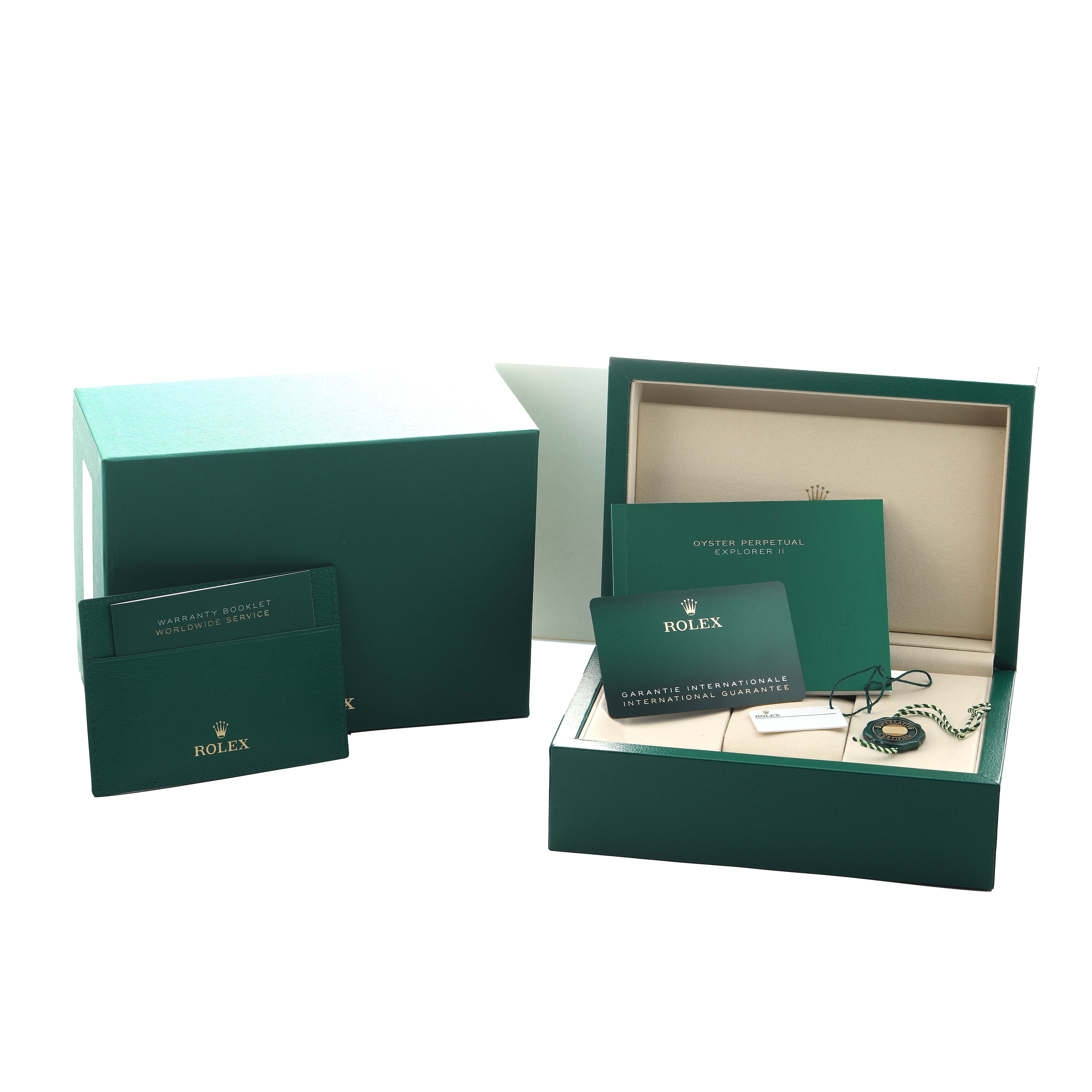 The image shows a Rolex Explorer 226570 Men's Stainless Steel White Dial box set with warranty booklets and a card at an angle revealing the open box and contents.