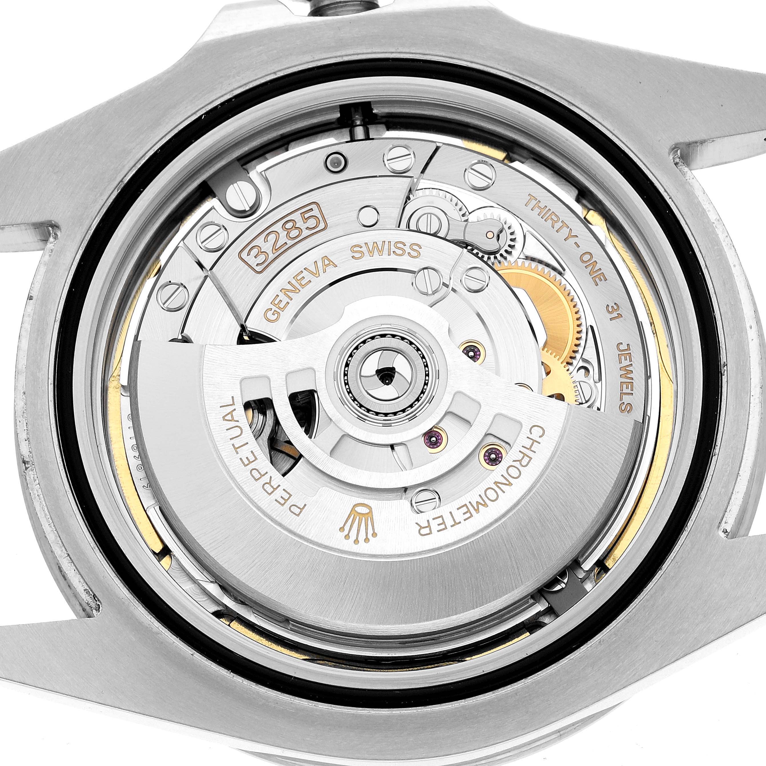 The image shows a close-up of the Rolex Explorer 226570 Men's Stainless Steel White Dial's movement from the back, highlighting the rotor and mechanical components.