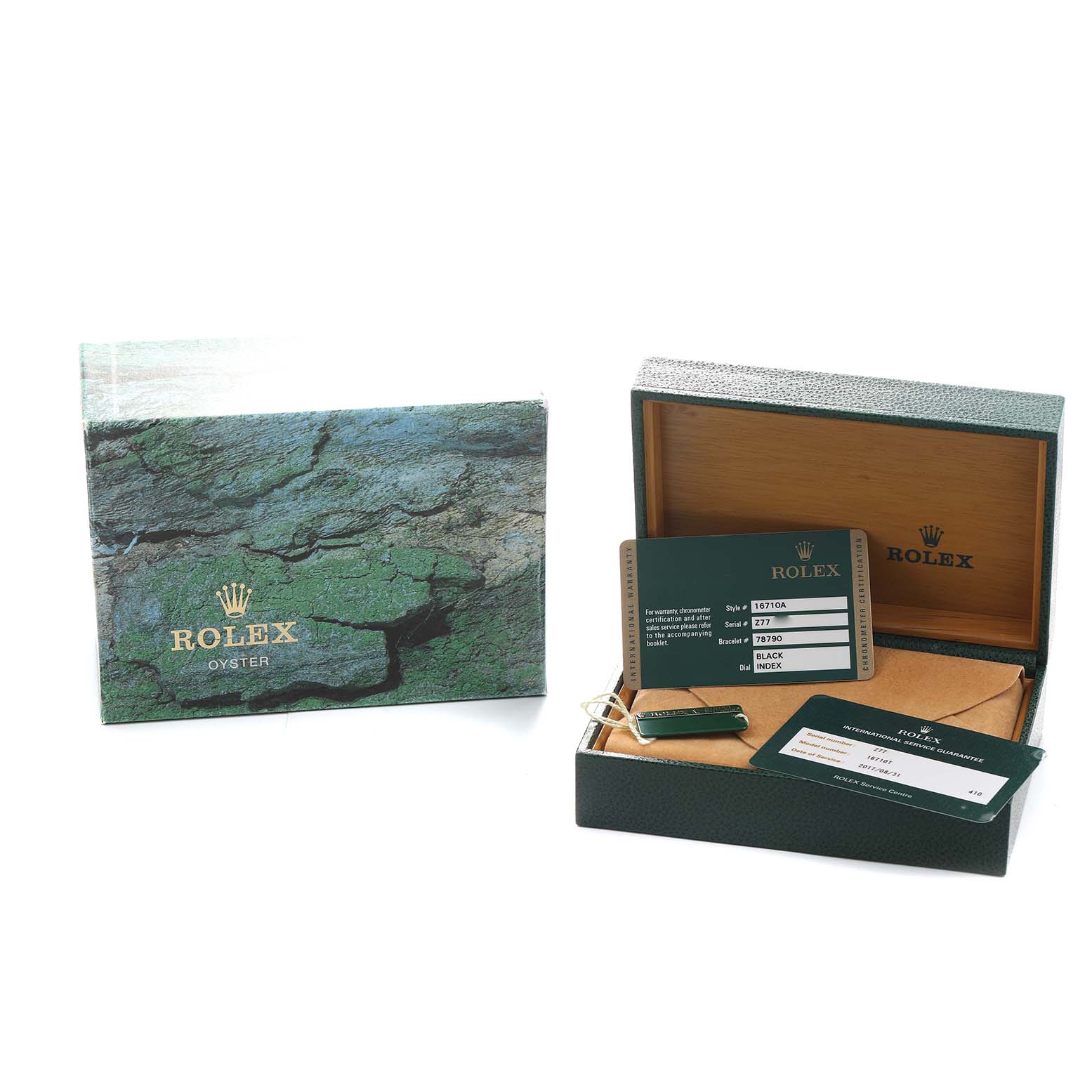 The image shows a Rolex GMT-Master 16710 Men's Stainless Steel Black Dial box, warranty card, and booklet from a slightly elevated angle.